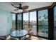 Enclosed lanai with views of the harbor and sliding glass doors at 5855 Midnight Pass Rd # 327, Sarasota, FL 34242