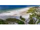 Scenic aerial shot of the beach with crystal-clear waters at 5855 Midnight Pass Rd # 327, Sarasota, FL 34242