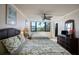 Bedroom featuring two beds, ceiling fan, and dresser at 5855 Midnight Pass Rd # 327, Sarasota, FL 34242