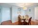 Cozy dining area with round table and seating for four at 5855 Midnight Pass Rd # 327, Sarasota, FL 34242