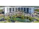 Expansive waterfront condos with a serene pond, lush landscaping and convenient parking at 5855 Midnight Pass Rd # 327, Sarasota, FL 34242