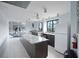 Large kitchen featuring a spacious island, modern appliances, and ample natural light at 5855 Midnight Pass Rd # 327, Sarasota, FL 34242