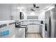 Modern kitchen with stainless steel appliances and white cabinetry at 5855 Midnight Pass Rd # 327, Sarasota, FL 34242