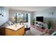 Living area with sliders to balcony and scenic city views at 5855 Midnight Pass Rd # 327, Sarasota, FL 34242