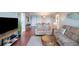 Cozy living area featuring hardwood floors and comfortable seating at 5855 Midnight Pass Rd # 327, Sarasota, FL 34242