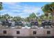 Outdoor kitchen area with multiple gas grills for community barbecues at 5855 Midnight Pass Rd # 327, Sarasota, FL 34242