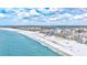 Scenic aerial view of a beachfront community with white sand, turquoise water and community amenities at 6140 Midnight Pass Rd # 103, Sarasota, FL 34242
