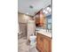 The renovated bathroom features a walk-in shower with seating, modern vanity, and updated fixtures at 6140 Midnight Pass Rd # 103, Sarasota, FL 34242