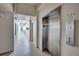 Hallway view featuring a modern stainless steel elevator for easy access to floors at 6140 Midnight Pass Rd # 103, Sarasota, FL 34242