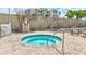 Inviting hot tub with brick surround, ideal for relaxation by the beach at 6140 Midnight Pass Rd # 103, Sarasota, FL 34242