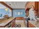 The kitchen's custom cabinetry and tile flooring add to the beauty, while modern appliances ensure convenience at 6140 Midnight Pass Rd # 103, Sarasota, FL 34242
