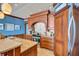 Close up of the beautiful wood cabinets, countertops, and cooking elements at 6140 Midnight Pass Rd # 103, Sarasota, FL 34242