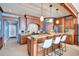 Stylish kitchen with a breakfast bar, custom cabinetry, and stainless steel appliances at 6140 Midnight Pass Rd # 103, Sarasota, FL 34242