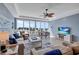 Relaxing living room with a large window showcasing beautiful ocean views at 6140 Midnight Pass Rd # 103, Sarasota, FL 34242