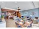 Open-concept living and dining area with modern decor and lots of natural light at 6140 Midnight Pass Rd # 103, Sarasota, FL 34242