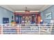 Open living space with a kitchen island, dining area, and comfortable seating with ocean views at 6140 Midnight Pass Rd # 103, Sarasota, FL 34242
