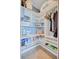 Pantry with shelving for storage and a variety of containers at 6140 Midnight Pass Rd # 103, Sarasota, FL 34242