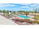 Beautiful resort-style pool area with palm trees and beach access at 6140 Midnight Pass Rd # 103, Sarasota, FL 34242