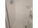 Shower with white tiled walls, a glass door, and a functional design, providing a clean bathing space at 6142 7Th Ave W # 6142, Bradenton, FL 34209