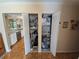 Hall closets with organized storage, shelving, and water heater at 6142 7Th Ave W # 6142, Bradenton, FL 34209