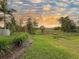 A lush backyard landscape offers serene views and a connection with nature at 6280 Cassia St, Bradenton, FL 34203