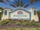 Entrance sign to the Poinciana Neal community with lush landscaping at 6280 Cassia St, Bradenton, FL 34203
