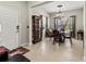 Elegant dining room featuring tile floors, decorative lighting, and ample natural light at 6280 Cassia St, Bradenton, FL 34203
