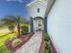 Charming covered front porch with stone walkway and comfortable seating area at 6280 Cassia St, Bradenton, FL 34203