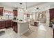 Open-concept kitchen with granite counters, stainless steel appliances, and breakfast bar at 6280 Cassia St, Bradenton, FL 34203