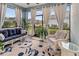 Screened lanai featuring a blue and white seating set with view of the neighborhood at 6280 Cassia St, Bradenton, FL 34203