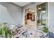 View from the screened lanai to the living room that features tile floors and neutral colors at 6280 Cassia St, Bradenton, FL 34203