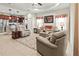 Spacious living room showcasing neutral colors, tile flooring, and view to open kitchen at 6280 Cassia St, Bradenton, FL 34203