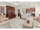 Open-concept living room and kitchen area featuring tile floors and neutral color palette at 6280 Cassia St, Bradenton, FL 34203