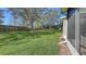 Spacious backyard with lush lawn and tall hedges at 7110 83Rd E Dr, Bradenton, FL 34201