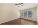 Bedroom featuring wood-style flooring, large window and neutral colored walls at 7110 83Rd E Dr, Bradenton, FL 34201