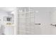 Bathroom featuring glass block shower wall and a double sink vanity at 7157 Strand Cir # 24-102, Bradenton, FL 34203