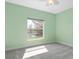 Bedroom featuring a large window with views of the lake and ceiling fan at 7157 Strand Cir # 24-102, Bradenton, FL 34203