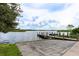 Community features boat ramp with wooden dock for easy lake access and enjoyment at 7157 Strand Cir # 24-102, Bradenton, FL 34203