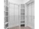 A walk-in closet featuring multiple shelving units and drawers for ample storage at 7157 Strand Cir # 24-102, Bradenton, FL 34203
