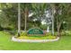 Tara Preserve golf and country club entrance sign surrounded by colorful landscaping, creating a welcoming first impression at 7157 Strand Cir # 24-102, Bradenton, FL 34203