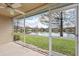 View from screen enclosed patio of waterfront scenery and green space at 7157 Strand Cir # 24-102, Bradenton, FL 34203