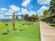Outdoor playground with swings, picnic tables, and lake views, perfect for Gathering fun and community gatherings at 7157 Strand Cir # 24-102, Bradenton, FL 34203