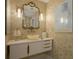 Stylish bathroom features a bowl sink, unique vanity, and gold accents at 750 N Tamiami Trl # 519, Sarasota, FL 34236