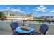 Charming balcony featuring cozy outdoor seating, perfect for relaxing and enjoying the views at 800 N Tamiami Trl # 312, Sarasota, FL 34236