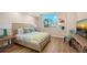 Inviting bedroom with a king-size bed, stylish decor, and bright natural light at 800 N Tamiami Trl # 312, Sarasota, FL 34236