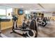 Modern fitness center with treadmills, elliptical machines, and TV screens for entertainment during workouts at 800 N Tamiami Trl # 312, Sarasota, FL 34236
