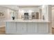 Well-lit kitchen featuring a large island with a marble countertop and modern appliances at 800 N Tamiami Trl # 312, Sarasota, FL 34236