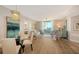 Open living space with dining area, balcony access and attractive contemporary decor at 800 N Tamiami Trl # 312, Sarasota, FL 34236