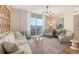 Cozy living area featuring comfortable seating, balcony access and stylish furnishings at 800 N Tamiami Trl # 312, Sarasota, FL 34236