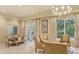 Bright lounge area offers cozy seating, decorative curtains, and an exit door for easy access at 800 N Tamiami Trl # 312, Sarasota, FL 34236